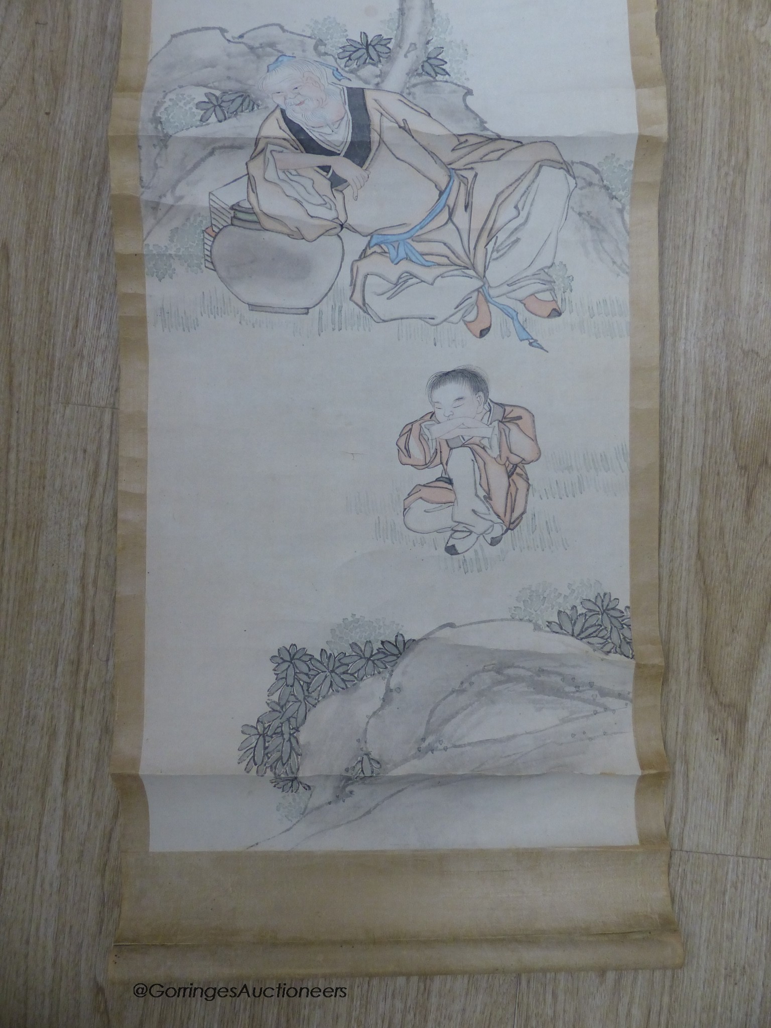 An early 20th century Chinese scroll painting on paper and scholar and boy